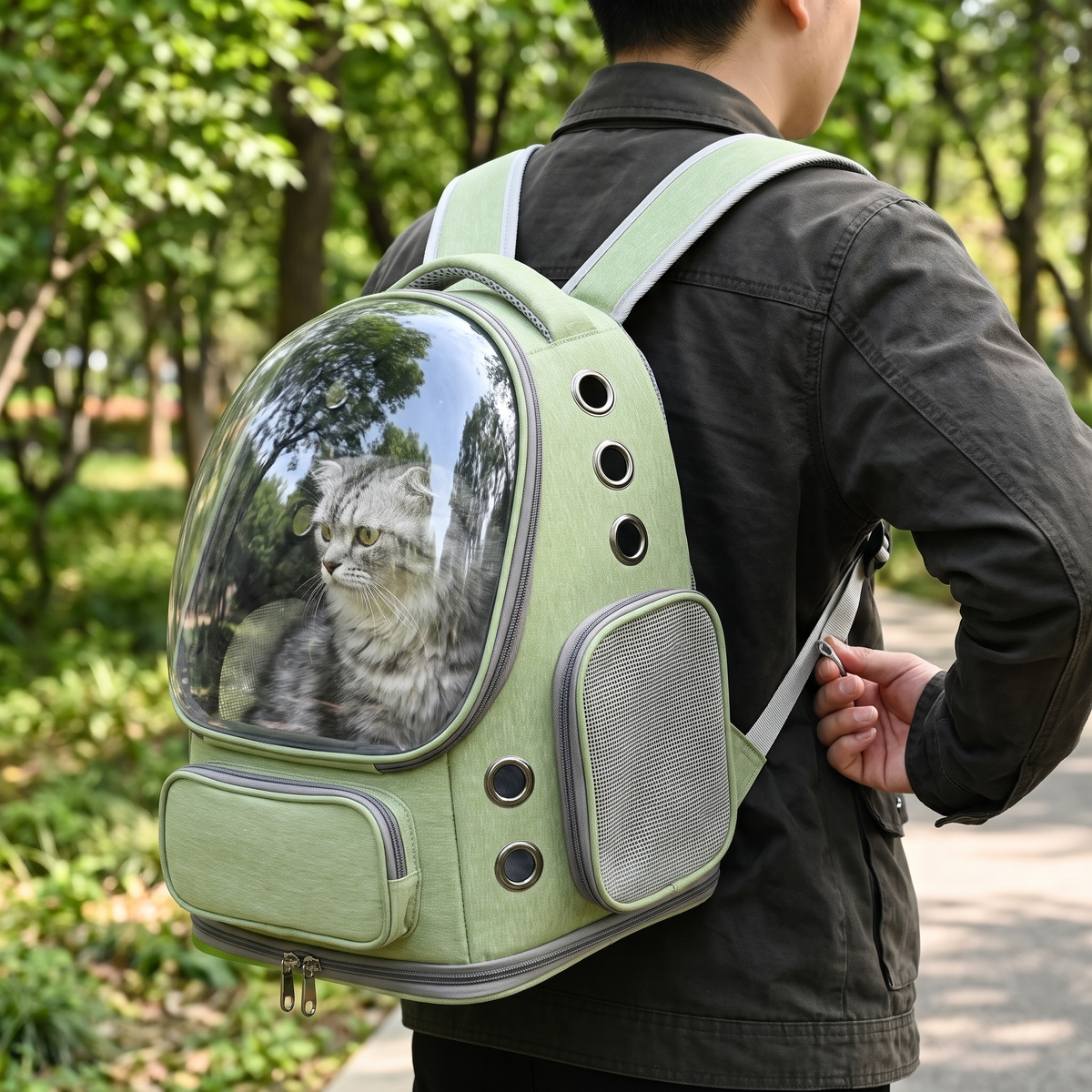 Orbit Bubble Pet Carrier Backpack being adjusted in the park
