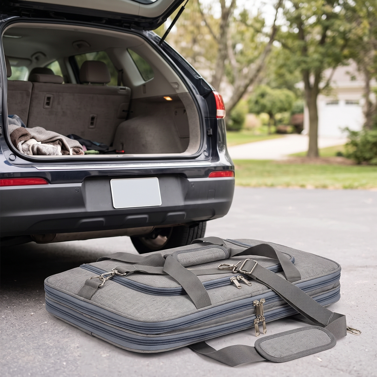 Voyage Collapsible Soft-Sided Pet Carrier folded flat by a car boot