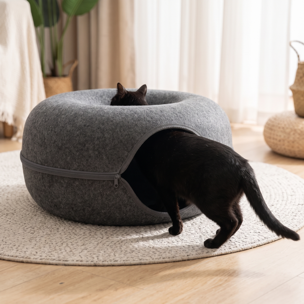 Hideaway Felt Cat Cave Bed with a black cat walking in