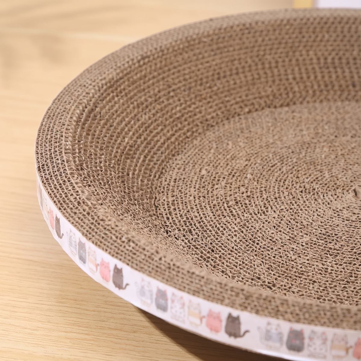 Ripple Oval Cardboard Cat Scratcher Bed cardboard surface close-up