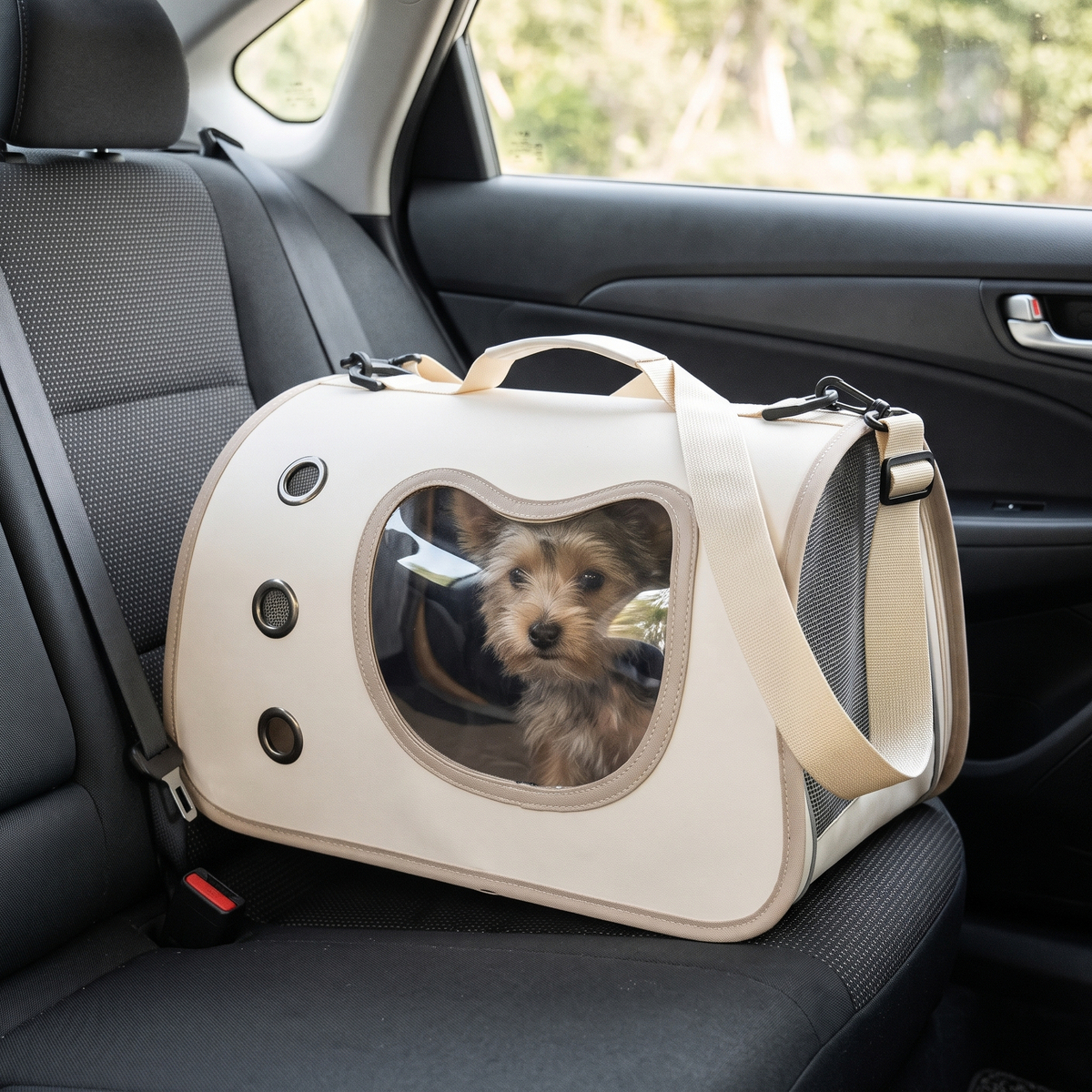 Cuddle Window Pet Carrier Bag with a small dog in the car